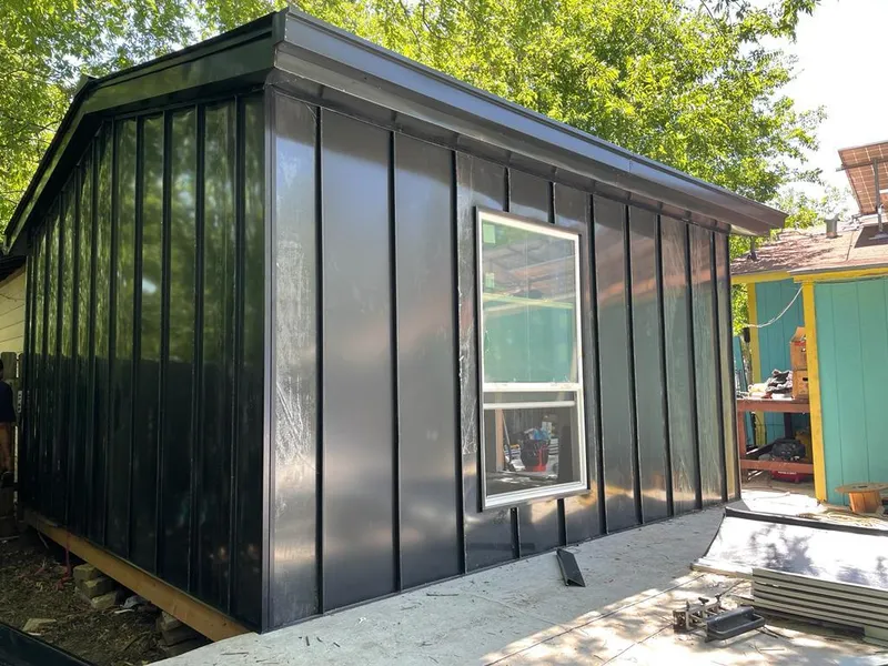 Black standing seam metal wall panels for Roof Inspection in Pleasant View